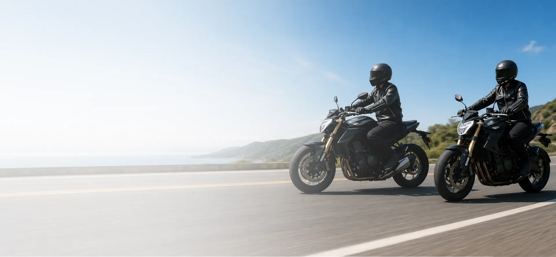 Two motorcycle riders travelling on an open road